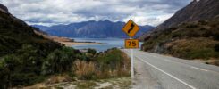 Driving in New Zealand for foreigners on a scenic coastal road